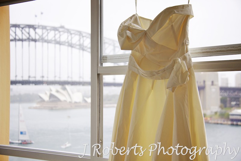 Wedding dress hanging up ready to put on - wedding photography sydney